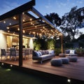 Teak wooden deck with decor furniture and ambient lighting. Side view of garden pergola with gas grill at twilight Generative AI. Royalty Free Stock Photo