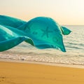 Teal Beach Towel with Starfish Design Blowing in the Wind Royalty Free Stock Photo