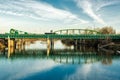 Teal blue Highway bridge across San Joaquin River