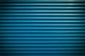 Teal blue painted horizontal metal window roller shutter blinds or garage doors background texture Royalty Free Stock Photo