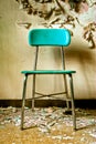 Teal Chair in Abandoned Building