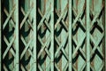 Teal color old rusty folding gate background