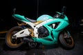 Teal color Suzuki gsxr motorcycle lit with flash Royalty Free Stock Photo