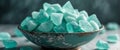 Teal Crystal Sugar Candy in Vintage Bowl Dark Background Royalty Free Stock Photo