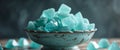 Teal Crystal Sugar Candy in Vintage Bowl Dark Background. Royalty Free Stock Photo