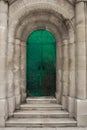 Teal door to the old historical mauseleum in the cemetary of town of supetar, croatia. Large stone grave dedicated to petrinovic Royalty Free Stock Photo