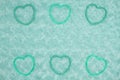 Teal frame hearts on pale teal rose plush fabric background