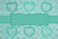 Teal frame hearts on pale teal rose plush fabric with ribbon background