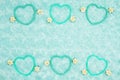 Teal frame hearts and rose buds on pale teal plush fabric background