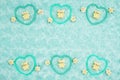 Teal frame hearts, teddy bears and rose buds on pale teal plush fabric background