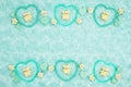 Teal frame hearts, teddy bears and rose buds on pale teal plush fabric background