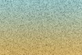 Teal and yellow glitter textured paper closeup background