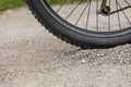 Tealby, Lincolnshire, UK, July 2017, Bike tire kicking up stones