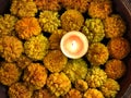 Tealight Candle Diya With Marigold Flower Floating in Water Inside Large Bowl. Happy Diwali - Hindu festival of lights Royalty Free Stock Photo