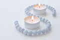 Tealight candles with aquamarine necklace. Royalty Free Stock Photo