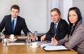 Team of 3 business people during meeting Royalty Free Stock Photo