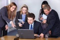 Team of 5 young businesspeople, conference room