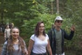 Team of active young people of boys and girls amicably walking a Royalty Free Stock Photo