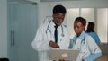 Team of african american doctors working with laptop Royalty Free Stock Photo