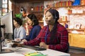 Team of agents in customer support office using headset mic to talk with clients Royalty Free Stock Photo