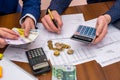 Team analyzes the business expenses of the annual budget