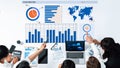 Team Analyzing Data on Digital Dashboard with Graphs and Charts Interactive Business Meeting in Modern Workspace Axiom Royalty Free Stock Photo