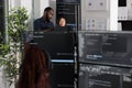 Team of app developers looking at coding algorithms on laptop Royalty Free Stock Photo