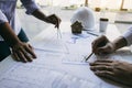 Team architect or engineering people discussion working on table together at a construction site Royalty Free Stock Photo