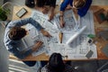 Team of Architects Collaboratively Designing Innovative Building Plans with Precision and Creativity, Utilizing Advanced