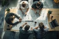 Team of Architects Collaboratively Designing Innovative Building Plans, Reviewing Blueprints and Sketches, Utilizing Modern