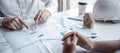 Team of architects or engineering consulting and analyzing working on objects tools and construction drawings inspection, Royalty Free Stock Photo