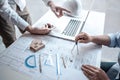 Team of architects or engineering consulting and analyzing working on objects tools and construction drawings inspection, Royalty Free Stock Photo
