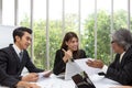 Team of asian business posing in meeting room. Working brainstorming at spacious board room at the office. Asian people. Royalty Free Stock Photo