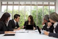 Team of asian business posing in meeting room. Working brainstorming on the table in a room. asian people. The office. Royalty Free Stock Photo