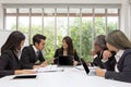 Team of asian business posing in meeting room. Working brainstorming on the table in a room. asian people. The office. Royalty Free Stock Photo