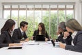 Team of asian business posing in meeting room. Working brainstorming on the table in a room. asian people. The office. Royalty Free Stock Photo