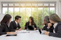 Team of asian business posing in meeting room. Working brainstorming on the table in a room. asian people. The office. Royalty Free Stock Photo