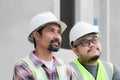 Team of Asian foremen, or head engineers construction supervisors wearing white helmet , happy Professional supervisors looking to Royalty Free Stock Photo