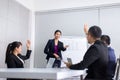 Team asian group discussing with hand raise up together in conference at office,Question and answer,Business people in board room Royalty Free Stock Photo