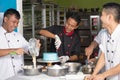 Team of asian male  pastry chef happy work together while preparing batter Royalty Free Stock Photo