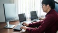 Team of asian programmer working together about new project to brainstorm and programming