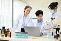 A team of Asian scientists are working together in the lab. teamwork concept Royalty Free Stock Photo