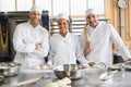 Team of bakers preparing dough Royalty Free Stock Photo