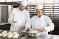 Team of bakers preparing dough Royalty Free Stock Photo