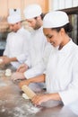 Team of bakers working at counter Royalty Free Stock Photo
