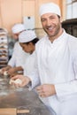 Team of bakers working at counter Royalty Free Stock Photo