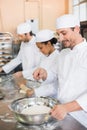 Team of bakers working at counter Royalty Free Stock Photo