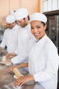 Team of bakers working at counter Royalty Free Stock Photo