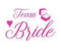 Team Bride pink quote with ring and heart. For t-shirts, wedding decoration. Vector text. Bachelorette party calligraphy. Royalty Free Stock Photo