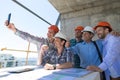 Team Of Builders Happy Smiling Take Selfie Photo During Meeting With Architect And Engineer On Construction Site Royalty Free Stock Photo